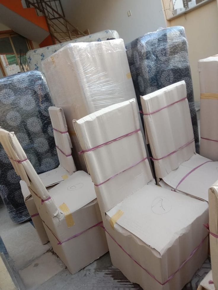 Packed household furniture stored at Karachi Packers warehouse
